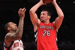 NEW YORK - JANUARY 28:  Hedo Turkoglu #26 of the Toronto Raptors shoots the ball over Wilson Chandler #21 of the New York Knicks at Madison Square Garden on January 28, 2010 in New York, New York. NOTE TO USER: User expressly acknowledges and agrees that, by downloading and or using this photograph, User is consenting to the terms and conditions of the Getty Images License Agreement.  (Photo by Nick Laham/Getty Images)
