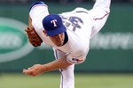 ARLINGTON, TX - JULY 10:  Pitcher Cliff Lee #33 of the Texas Rangers throws against the Baltimore Orioles on July 10, 2010 at Rangers Ballpark in Arlington, Texas.  (Photo by Ronald Martinez/Getty Images)