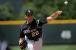 DENVER - MAY 24:  Starting pitcher Jeff Francis #26 of the Colorado Rockies delivers against the New York Mets in the first inning at Coors Field on May 24, 2008 in Denver, Colorado. Francis collected the loss as the Mets defeated the Rockies 9-2.  (Photo by Doug Pensinger/Getty Images)
