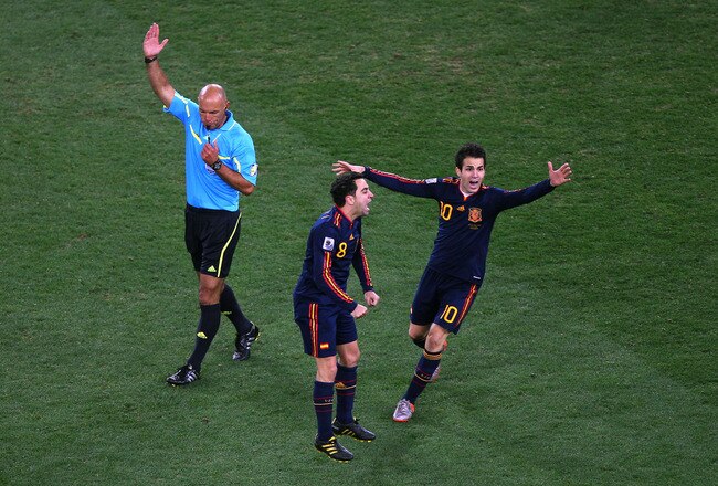 JOHANNESBURG, SOUTH AFRICA - JULY 11:  Xavi Hernandez and Francesc Fabregas of Spain celebrate winning the World Cup as referee Howard Webb blows the final whistle during the 2010 FIFA World Cup South Africa Final match between Netherlands and Spain at Soccer City Stadium on July 11, 2010 in Johannesburg, South Africa.  (Photo by Michael Steele/Getty Images)