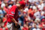 ST. LOUIS - MAY 22: Starting pitcher Scott Kazmir #19 of the Los Angeles Angels of Anaheim reacts to giving up a two-run home run against the St. Louis Cardinals at Busch Stadium on May 22, 2010 in St. Louis, Missouri.  The Angels beat the Cardinals 10-7.  (Photo by Dilip Vishwanat/Getty Images)