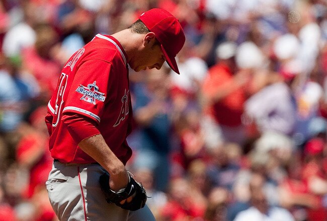 ST. LOUIS - MAY 22: Starting pitcher Scott Kazmir #19 of the Los Angeles Angels of Anaheim reacts to giving up a two-run home run against the St. Louis Cardinals at Busch Stadium on May 22, 2010 in St. Louis, Missouri.  The Angels beat the Cardinals 10-7.  (Photo by Dilip Vishwanat/Getty Images)