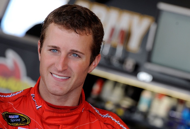 JOLIET, IL - JULY 09:  Kasey Kahne, driver of the #9 Budweiser Ford, looks on in the garage during practice for the NASCAR Sprint Cup Series LIFELOCK.COM 400 at the Chicagoland Speedway on July 9, 2010 in Joliet, Illinois.  (Photo by John Harrelson/Getty Images for NASCAR)