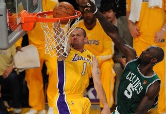 LOS ANGELES, CA - JUNE 15:  Jordan Farmar #1 of the Los Angeles Lakers dunks the ball in front of Kevin Garnett #5 of the Boston Celtics in Game Six of the 2010 NBA Finals at Staples Center on June 15, 2010 in Los Angeles, California.  NOTE TO USER: User expressly acknowledges and agrees that, by downloading and/or using this Photograph, user is consenting to the terms and conditions of the Getty Images License Agreement.  (Photo by Lisa Blumenfeld/Getty Images)