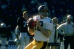 1977:  Quarterback Terry Bradshaw #12 of the Pittsburgh Steelers drops back to pass during a game against the Oakland Raiders at the Oakland Coliseum in Oakland, California. The Raiders defeated the Steelers 16-7. Mandatory Credit: Allsport  /Allsport