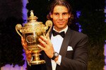 LONDON, ENGLAND - JULY 04:  Rafael Nadal of Spain with the winners trophy at the Wimbledon Championships 2010 Winners Ball at the InterContinental Park Lane Hotel on July 4, 2010 in London, England.  (Photo by Julian Finney/Getty Images)