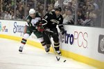 DALLAS - JANUARY 18:  Center Mike Modano #9 of the Dallas Stars skates the puck against Marek Zidlicky #3 of the Minnesota Wild at American Airlines Center on January 18, 2010 in Dallas, Texas.  (Photo by Ronald Martinez/Getty Images)