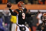 CINCINNATI - JANUARY 9:  Quarterback Carson Palmer #9 of the Cincinnati Bengals passes the ball in the fourth quarter against the New York Jets during the 2010 AFC wild-card playoff game at Paul Brown Stadium on January 9, 2010 in Cincinnati, Ohio. (Photo by Jonathan Daniel/Getty Images)