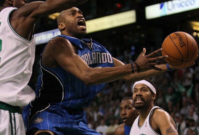 BOSTON - MAY 28:  Vince Carter #15 of the Orlando Magic drives for a shot attempt against Tony Allen #42 of the Boston Celtics in Game Six of the Eastern Conference Finals during the 2010 NBA Playoffs at TD Garden on May 28, 2010 in Boston, Massachusetts.  NOTE TO USER: User expressly acknowledges and agrees that, by downloading and/or using this Photograph, user is consenting to the terms and conditions of the Getty Images License Agreement.  (Photo by Jim Rogash/Getty Images)