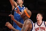 NEW YORK - JANUARY 24:  Drew Gooden #90 of the Dallas Mavericksdrives to the basket past David Lee #42 of the New York Knicks at Madison Square Garden January 24, 2010 in New York City. The Knicks lost the game 78-128. NOTE TO USER: User expressly acknowledges and agrees that, by downloading and/or using this Photograph, User is consenting to the terms and conditions of the Getty Images License Agreement.  (Photo by Chris McGrath/Getty Images)