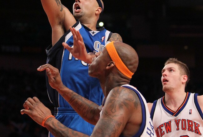 NEW YORK - JANUARY 24:  Drew Gooden #90 of the Dallas Mavericksdrives to the basket past David Lee #42 of the New York Knicks at Madison Square Garden January 24, 2010 in New York City. The Knicks lost the game 78-128. NOTE TO USER: User expressly acknowledges and agrees that, by downloading and/or using this Photograph, User is consenting to the terms and conditions of the Getty Images License Agreement.  (Photo by Chris McGrath/Getty Images)