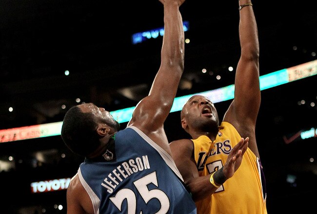 LOS ANGELES, CA - MARCH 19:  :Lamar Odom #7 of the Los Angeles Lakers shoots over Al Jefferson #25 of the Minnesota Timberwolves on March 19, 2010 at Staples Center in Los Angeles, California.  The Lakers won 104-96.  NOTE TO USER: User expressly acknowledges and agrees that, by downloading and/or using this Photograph, user is consenting to the terms and conditions of the Getty Images License Agreement.  (Photo by Stephen Dunn/Getty Images)