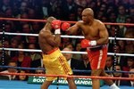 5 Nov 1995:  George Foreman trows a left punch at Michael Moorer during the fight in Las Vegas. Forman wins by a knock out in round 10. Mandatory Credit: Al Bello  /Allsport