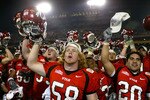 TEMPE, AZ - JANUARY 1:  The Utah team celebrates after defeating Pittsburgh 35-7 in the Tostito's Fiesta Bowl at the Sun Devil Stadium on January 1, 2005 in Tempe, Arizona. (Photo by Jeff Gross/Getty Images).