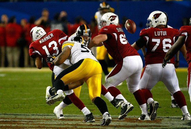 TAMPA, FL - FEBRUARY 01:  Quarterback Kurt Warner #13 of the Arizona Cardinals fumbles the ball with :15 seconds to play as he is sacked by LaMarr Woodley #56 of the Pittsburgh Steelers during Super Bowl XLIII on February 1, 2009 at Raymond James Stadium in Tampa, Florida. Steelers won 27-23.  (Photo by Win McNamee/Getty Images)