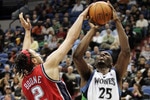 MINNEAPOLIS, MN - OCTOBER 28: Al Jefferson #25 of the Minnesota Timberwolves gets fouled by Josh Boone #2 of the New Jersey Nets in the second quarter at the Target Center on October 28, 2009 in Minneapolis, Minnesota. (Photo by Genevieve Ross/Getty Images)
