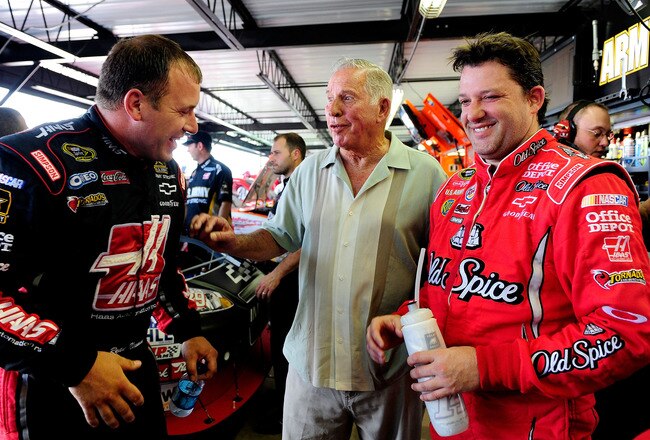DARLINGTON, SC - MAY 07:  Ryan Newman (L), driver of the #39 Haas Automation Chevrolet, talks with NASCAR legend David Pearson (C), and Tony Stewart (R), driver of the #14 Old Spice/Office Depot Chevrolet, in the garage during practice for the NASCAR Sprint Cup Series SHOWTIME Southern 500 at Darlington Raceway on May 7, 2010 in Darlington, South Carolina.  (Photo by Rusty Jarrett/Getty Images for NASCAR)