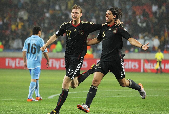 PORT ELIZABETH, SOUTH AFRICA - JULY 10:  Sami Khedira of Germany celebrates scoring his team's third goal with Per Mertesacker during the 2010 FIFA World Cup South Africa Third Place Play-off match between Uruguay and Germany at The Nelson Mandela Bay Stadium on July 10, 2010 in Port Elizabeth, South Africa.  (Photo by Doug Pensinger/Getty Images)