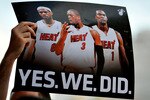 MIAMI - JULY 09:  A fan holds up a poster  of Chris Bosh #1, Dwyane Wade #3 and LeBron James #6 of the Miami Heat before the start of a welcome party for the new players at American Airlines Arena on July 9, 2010 in Miami, Florida.  (Photo by Doug Benc/Getty Images)
