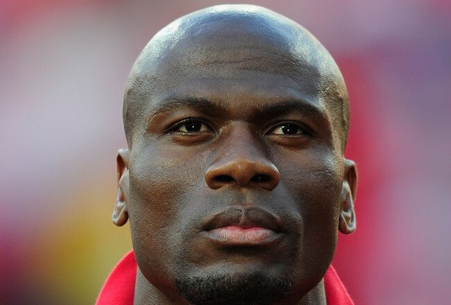 PORT ELIZABETH, SOUTH AFRICA - JUNE 21:  Blaise Nkufo of Switzerland lines up for the national anthems prior to the the 2010 FIFA World Cup South Africa Group H match between Chile and Switzerland at Nelson Mandela Bay Stadium on June 21, 2010 in Port Elizabeth, South Africa.  (Photo by Stuart Franklin/Getty Images)