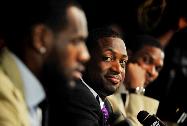MIAMI - JULY 09:  Dwyane Wade #3 (C) of the Miami Heat talks during a press conference after a welcome party at American Airlines Arena on July 9, 2010 in Miami, Florida.  (Photo by Doug Benc/Getty Images)