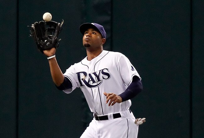ST PETERSBURG, FL - MAY 01:  Outfielder Carl Crawford #13 of the Tampa Bay Rays catches a fly ball against the Kansas City Royals during the game at Tropicana Field on May 1, 2010 in St. Petersburg, Florida.  (Photo by J. Meric/Getty Images)