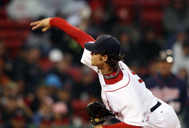 BOSTON - MAY 19:  Clay Buchholz #11 of the Boston Red Sox delivers a pitch in the first inning against the Minnesota Twins on May 19, 2010 at Fenway Park in Boston, Massachusetts.  (Photo by Elsa/Getty Images)