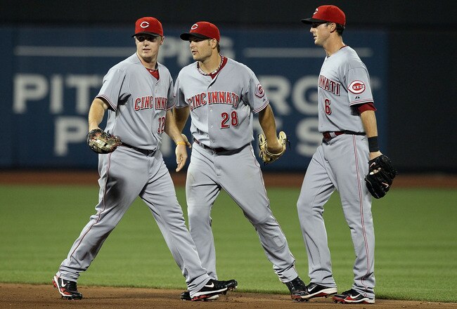 NEW YORK - JULY 07:  (L-R) Jay Bruce #32, Chris Heisey #28, and Drew Stubbs #6 of the Cincinnati Reds celebrate after the final out of the game against the New York Mets on July 7, 2010 at Citi Field in the Flushing neighborhood of the Queens borough of New York City. The Reds defeated the Mets 3-1.  (Photo by Jim McIsaac/Getty Images)