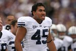 SEATTLE - SEPTEMBER 6:  Harvey Unga #45 of the BYU Cougars looks on from the sideline during their game against the Washington Huskies on September 6, 2008 at Husky Stadium in Seattle, Washington. The Cougars defeated the Huskies 28-27. (Photo by Otto Greule Jr/Getty Images)