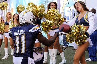 SAN DIEGO - NOVEMBER 15:  Legendu Naanee #11 of the San Diego Chargers offers the football to a Chargers cheerleader after a scoring a touchdown against the Philadelphia Eagles at Qualcomm Stadium on November 15, 2009 in San Diego, California.  (Photo by Kevork Djansezian/Getty Images)