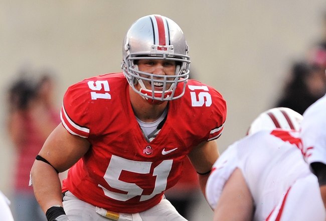 COLUMBUS, OH - OCTOBER 10:  Linebacker Ross Homan #51 of the Ohio State Buckeyes waits for the snap against the Wisconsin Badgers at Ohio Stadium on October 10, 2009 in Columbus, Ohio.  (Photo by Jamie Sabau/Getty Images)