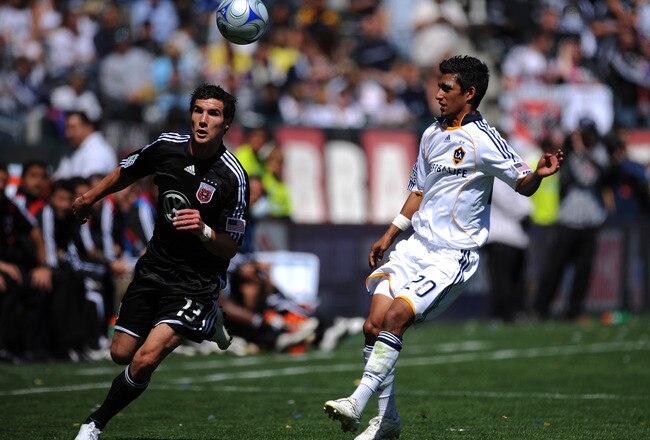 CARSON, CA - MARCH 22:  Chris Pontius #13 of D.C. United fights for the ball with A.J. DeLaGarza #20 of the Los Angeles Galaxy at the Home Depot Center on March 22, 2009 in Carson, California.  (Photo by Robert Laberge/Getty Images)
