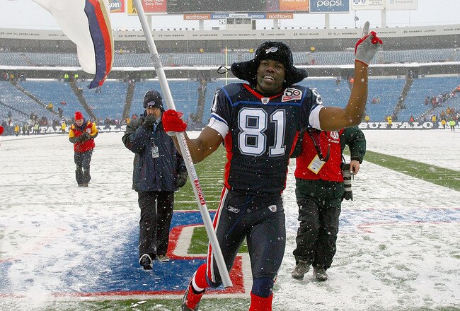 ORCHARD PARK, NY - JANUARY 03: Terrell Owens #81 of the Buffalo Bills runs off the field with a Bills flag after the Bills defeated the Indianapolis Colts at Ralph Wilson Stadium on January 3, 2010 in Orchard Park, New York. Buffalo won 30-7. (Photo by Rick Stewart/Getty Images)