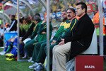 PORT ELIZABETH, SOUTH AFRICA - JULY 02:  Carlos Dunga head coach of Brazil sits on the bench with coaching staff ahead of the 2010 FIFA World Cup South Africa Quarter Final match between Netherlands and Brazil at Nelson Mandela Bay Stadium on July 2, 2010 in Nelson Mandela Bay/Port Elizabeth, South Africa.  (Photo by Laurence Griffiths/Getty Images)