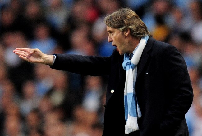 MANCHESTER, ENGLAND - MAY 05:  Manchester City Manager Roberto Mancini issues instructions during the Barclays Premier League match between Manchester City and Tottenham Hotspur at the City of Manchester Stadium on May 5, 2010 in Manchester, England.  (Photo by Shaun Botterill/Getty Images)