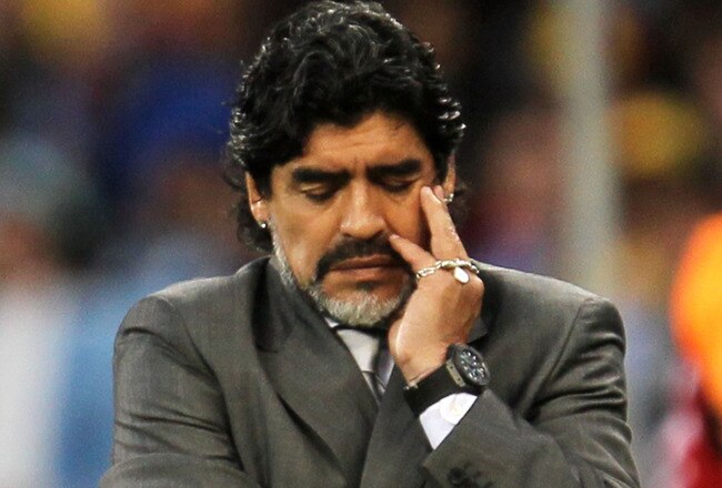 CAPE TOWN, SOUTH AFRICA - JULY 03:  Diego Maradona head coach of Argentina shows his dejection as he suffers a massive defeat in the 2010 FIFA World Cup South Africa Quarter Final match between Argentina and Germany at Green Point Stadium on July 3, 2010 in Cape Town, South Africa.  (Photo by Chris McGrath/Getty Images)