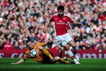 LONDON, ENGLAND - APRIL 03:  Eduardo of Arsenal is challenged by Jody Craddock of Wolverhampton Wanderers during the Barclays Premier League match between Arsenal and Wolverhampton Wanderers at the Emirates Stadium on April 3, 2010 in London, England.  (Photo by Mike Hewitt/Getty Images)