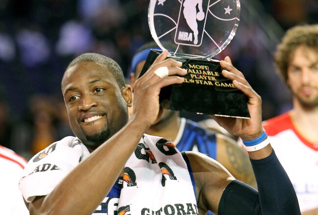 ARLINGTON, TX - FEBRUARY 14:  Dwayne Wade #3 of the Eastern Conference celebrates with the trophy after being named the MVP of the NBA All-Star Game, part of 2010 NBA All-Star Weekend at Cowboys Stadium on February 14, 2010 in Arlington, Texas. The Eastern Conference defeated the Western Conference 141-139 in regulation.  NOTE TO USER: User expressly acknowledges and agrees that, by downloading and or using this photograph, User is consenting to the terms and conditions of the Getty Images License Agreement.  (Photo by Ronald Martinez/Getty Images)