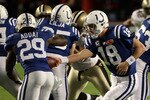 MIAMI GARDENS, FL - FEBRUARY 07:  Quarterback Peyton Manning #18 of the Indianapolis Colts looks to hand off to #29 Joseph Addai against the New Orleans Saints during Super Bowl XLIV on February 7, 2010 at Sun Life Stadium in Miami Gardens, Florida.  (Photo by Elsa/Getty Images)