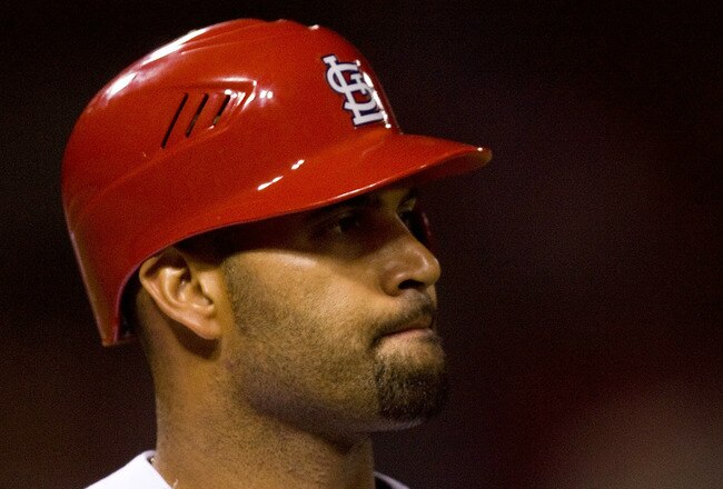 ST. LOUIS - JULY 2: Albert Pujols #5 of the St. Louis Cardinals reacts to striking out against the Milwaukee Brewers at Busch Stadium on July 2, 2010 in St. Louis, Missouri.  The Cardinals beat the Brewers 5-0.  (Photo by Dilip Vishwanat/Getty Images)