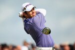 ST ANDREWS, SCOTLAND - JULY 16:  Louis Oosthuizen of South Africa hits his tee shot on the 17th hole during the second round of the 139th Open Championship on the Old Course, St Andrews on July 16, 2010 in St Andrews, Scotland.  (Photo by Ross Kinnaird/Getty Images)