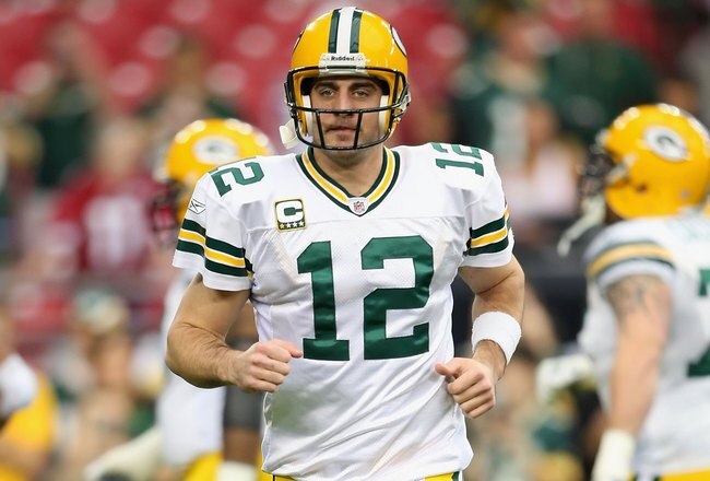GLENDALE, AZ - JANUARY 10:  Quarterback Aaron Rodgers #12 of the Green Bay Packers warms up before the 2010 NFC wild-card playoff game against the Arizona Cardinals at the Universtity of Phoenix Stadium on January 10, 2010 in Glendale, Arizona.  The Cardinals defeated the Packers  51-45 in overtime.  (Photo by Christian Petersen/Getty Images)