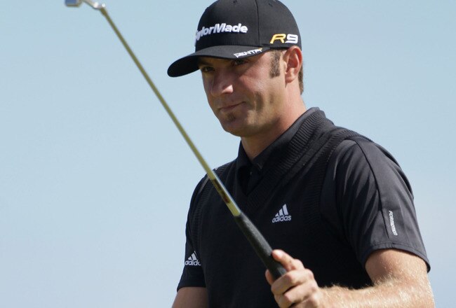 ST ANDREWS, SCOTLAND - JULY 17:  Dustin Johnson of the USA walks across the sixth green during the third round of the 139th Open Championship on the Old Course, St Andrews on July 17, 2010 in St Andrews, Scotland.  (Photo by Andrew Redington/Getty Images)