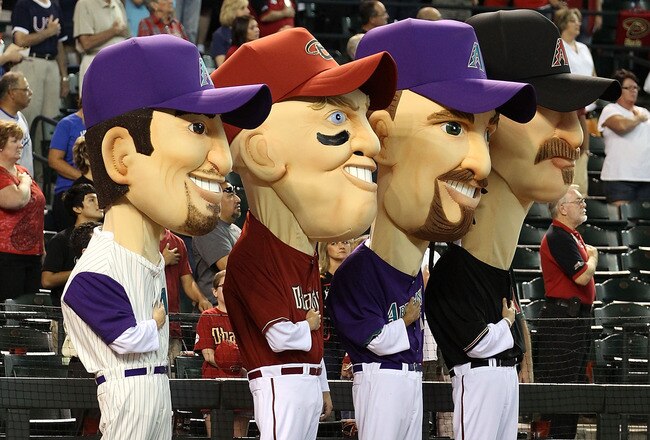 PHOENIX - JULY 03: The Arizona Diamondbacks 'legends' (L-R) Luis Gonzalez, Matt Williams, Mark Grace and Randy Johnson stand attended for the National Anthem before the Major League Baseball game against the Los Angeles Dodgers at Chase Field on July 3, 2010 in Phoenix, Arizona.  (Photo by Christian Petersen/Getty Images)
