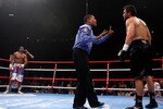 MANCHESTER, ENGLAND - APRIL 03:  David Haye (l) of England waits in a neutral corner as John Ruiz (r) of USA is given a mandatory count by the referee during the World Heavyweight Bout at the MEN Arena on April 3, 2010 in Manchester, England.  (Photo by Michael Steele/Getty Images)