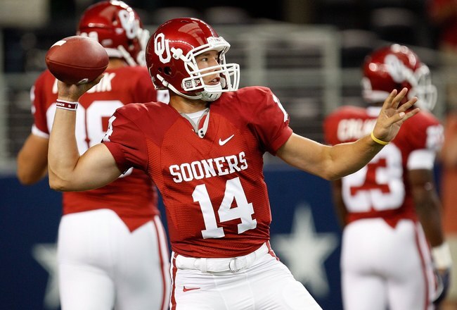 ARLINGTON, TX - SEPTEMBER 05:  Quarterback Sam Bradford #14 of the Oklahoma Sooners warms up before a game against the Brigham Young Cougars at Cowboys Stadium on September 5, 2009 in Arlington, Texas.  (Photo by Ronald Martinez/Getty Images)