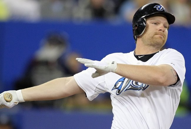 TORONTO - APRIL 12:  Adam Lind #26 of the Toronto Blue Jays swings at the pitch against the Chicago White Sox during their MLB game at the Rogers Centre April 12, 2010 in Toronto, Ontario.(Photo By Dave Sandford/Getty Images)