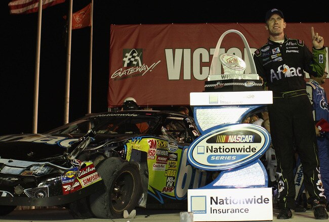 MADISON, IL - JULY 17: Carl Edwards driver of the #60 Aflac Ford poses with the trophy after winning the NASCAR Nationwide Series Missouri-Illinois Dodge Dealers 250 at Gateway International Raceway on July 17, 2010 in Madison, Illinois.  (Photo by Dilip Vishwanat/Getty Images for NASCAR)