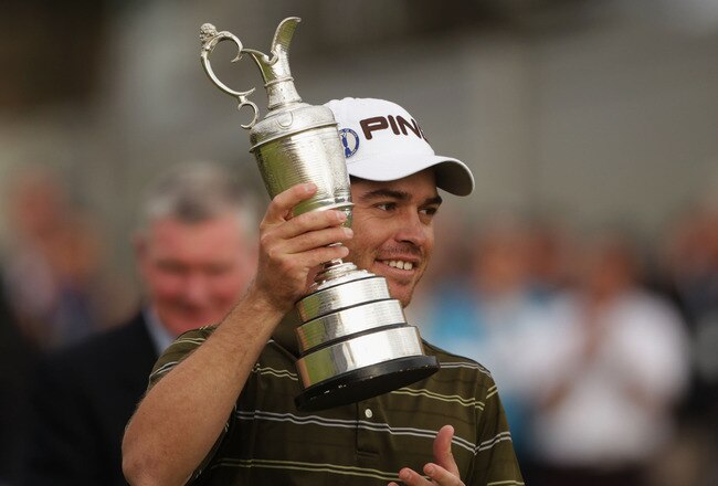 ST ANDREWS, SCOTLAND - JULY 18:  Louis Oosthuizen of South Africa poses with the Claret Jug after his seven-stroke victory at the 139th Open Championship on the Old Course, St Andrews on July 18, 2010 in St Andrews, Scotland.  (Photo by Andrew Redington/Getty Images)