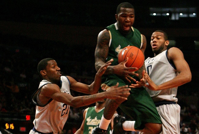 NEW YORK - MARCH 10:  Dominique Jones #20 of the USF Bulls loses control of the ball against Jason Clark #21 and Greg Monroe #10 of the Georgetown Hoyas during the second round of 2010 NCAA Big East Tournament at Madison Square Garden on March 10, 2010 in New York City.  (Photo by Chris Trotman/Getty Images)